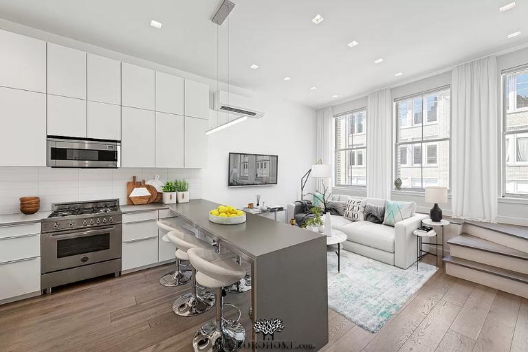 Primary Photo - The open kitchen is complete with a suite ...