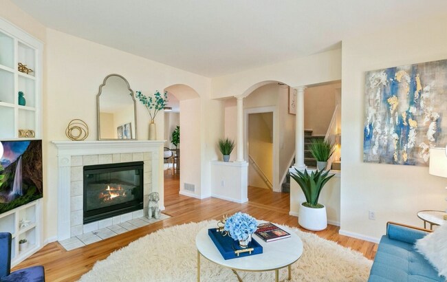 Living room with working gas fireplace. - 4599 W 36th Ave