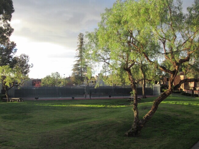 view of community park &amp; tennis courts from balcony - 436 Dempsey Road