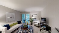 Located at 100 Hunt Club Trl in Marlton, NJ, this single-floor residence offers a thoughtfully designed layout with 2 bedrooms, 2 bathrooms, a kitchen, dining room, living room, in-unit laundry, and multiple closets for ample storage. The living room is bright and inviting, featuring neutral gray walls, plush carpeting, and sliding glass doors that open to a private outdoor patio with views of surrounding greenery. The adjacent dining room makes a bold statement with deep navy accent walls, a pendant light fixture, a large wall mirror that adds depth, and carpeted flooring. The galley-style kitchen is well-equipped with rich dark wood cabinetry, granite-look countertops, hardwood flooring, and stainless steel appliances including a refrigerator, range, and microwave. Each bathroom features a tub-shower combination, hardwood flooring, and a vanity with dark wood cabinetry. The primary bedroom is generously sized with soft carpeting, neutral tones, and large windows that invite natural light. A dedicated in-unit laundry room houses a full-size washer and dryer with overhead shelving. Multiple hallways and closets throughout the home enhance functionality and flow.