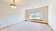 Located at 2848 N Brookfield Rd in Brookfield, Wisconsin, this single-floor, one-bedroom, one-bathroom unit offers a practical and well-organized layout. The kitchen is a functional highlight, featuring warm maple cabinetry, dark countertops, tile flooring, and a peninsula with a double-basin sink and pendant lighting overhead. Track lighting and a window allow natural light to brighten the space. White appliances, including a refrigerator, electric range, microwave, and dishwasher, are all included. The open design of the kitchen connects seamlessly to the living area, which is finished with neutral carpet and a window that brings in additional natural light. The generously sized bedroom offers ample room and includes a double-door closet with maple finishes, carpet flooring, and a dedicated electrical panel access point. The full bathroom is clean and straightforward, featuring tile flooring, a shower-tub combination, and warm wood-trimmed accents consistent with the rest of the unit. Throughout the space, white walls, wood-toned trim, and consistent finishes create a cohesive, neutral aesthetic that is move-in ready and easy to personalize.
