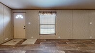 Located at 2214 E Fourth Ave in Hutchinson, Kansas, this single-floor, three-bedroom, two-bathroom home offers a practical and comfortable layout. Wood-look plank flooring runs consistently throughout the entire home, providing a cohesive and warm aesthetic. The open-concept kitchen and living area serves as the heart of the home, featuring light wood cabinetry with ample storage, black appliances including a range and refrigerator, recessed lighting, and a ceiling fan that enhances airflow and comfort. Natural light enters through windows fitted with blinds, brightening the living space near the front entry door. The three bedrooms are well-proportioned, each finished with the same wood-look flooring and neutral textured wall panels trimmed with warm wood accents. The primary bedroom includes a dedicated closet with a wire shelf for organized storage. Both bathrooms are appointed with light wood vanity cabinetry, single-basin sinks with updated fixtures, mirrored storage, and a tub-shower combination. The consistent finishes and neutral color palette throughout create a clean, move-in-ready environment suited for everyday living.