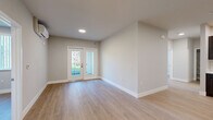 Located at 1866 Lincoln Ave in Calistoga, California, this single-floor, 3-bedroom, 2-bathroom home offers a thoughtfully designed layout with a clean, contemporary aesthetic. Light wood-tone flooring runs throughout, complementing neutral gray-beige walls and crisp white trim to create a bright, cohesive interior.

The open living area connects seamlessly to the kitchen and features French-style glass doors that lead to a private balcony, allowing natural light to pour in and offering pleasant outdoor views. A wall-mounted mini-split system provides efficient climate control.

The kitchen is well-appointed with rich dark espresso shaker-style cabinetry, white countertops, a stainless steel sink, and a full suite of stainless steel appliances including a range, microwave, dishwasher, and refrigerator — making it both functional and visually striking.

The three bedrooms are comfortably proportioned, with the primary bedroom featuring direct access to a bathroom and a dedicated closet with built-in rod storage. The bedrooms include windows with vertical blinds that frame views of the surrounding greenery. The two bathrooms are finished cleanly, one featuring a full tub-shower combination with white tile surround.

A central hallway connects the living spaces efficiently, rounding out this well-organized, move-in-ready home in the heart of Napa Valley wine country.