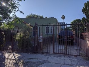 Fully Gated property/Secure and safe with two parking spaces in the rear of the driveway . - 2215 Carmona Ave
