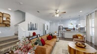 Located in San Antonio, TX, this two-story, two-bedroom, four-bathroom home offers a well-designed layout spread across two comfortable floors. The main level features an open-concept living and dining area with rich polished concrete floors, recessed lighting, and ceiling fans throughout. Large windows invite abundant natural light, creating a bright and welcoming ambiance. The living room flows seamlessly into a well-appointed kitchen-living combination, ideal for entertaining. The kitchen is outfitted with crisp white shaker cabinetry, gray tile backsplash, granite countertops, stainless steel appliances, and a central island with pendant lighting. A pantry and dedicated laundry room with built-in shelving add practical convenience on the main floor. Upstairs, the two bedrooms are finished with soft carpeting and ceiling fans. The primary bedroom offers a generous layout with a walk-in closet featuring dual hanging rods. The second bedroom also includes closet access and ample space. Four full bathrooms serve the home, including one with a tub-shower combination and wood-look tile flooring. Multiple closets throughout provide excellent storage. The home's clean, neutral palette and thoughtful layout make it a functional and comfortable residence in the 78249 zip code.