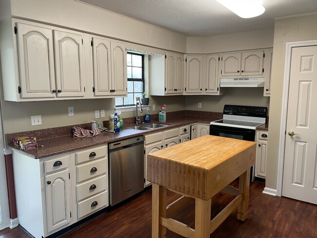 Kitchen with quartz countertops and stainless appliances There is a new stove since this picture. - 198 Culver St