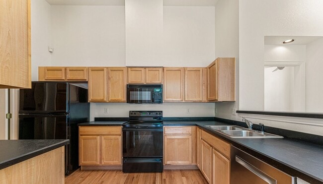 Building Photo - Gorgeous Townhome With 2-Car Garage and Ce...