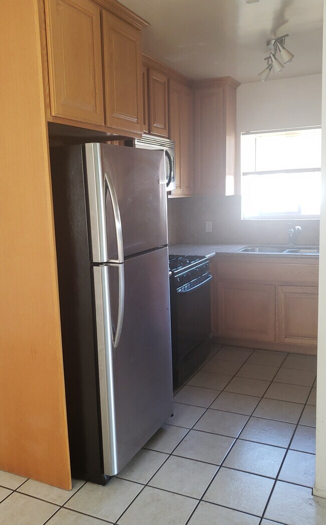 new stainless refrigerator - 11009 Venice Blvd