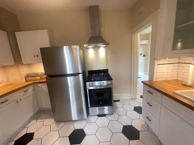 new appliances and cabinets- gas range - 206 Palo Blanco St