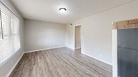 Located at 526 Carl Street in Gastonia, NC, this single-story, one-bedroom, one-bathroom home offers a well-organized and functional layout across a compact yet efficiently utilized footprint. The interior is finished with neutral gray tones throughout, creating a clean and cohesive aesthetic from room to room.

The living room welcomes you with wood-look laminate flooring, a large window dressed with blinds that allows natural light to fill the space, and a textured ceiling that carries through the home. The kitchen is well-appointed with crisp white cabinetry — both upper and lower — providing ample storage, complemented by a stainless steel double-basin sink, a black electric range with overhead ventilation, and matching wood-look flooring.

The bedroom is a comfortable size, featuring soft neutral carpet, a textured ceiling, and direct access to a closet, offering practical storage. The bathroom is cleanly finished with wood-look flooring, a bathtub/shower combination, toilet, and chrome fixtures and towel hardware. The home also includes a dedicated laundry area, adding to its everyday convenience.

Overall, this home presents a tidy, move-in-ready environment with consistent finishes and a straightforward layout well-suited for efficient single-occupancy living in Gastonia, NC.