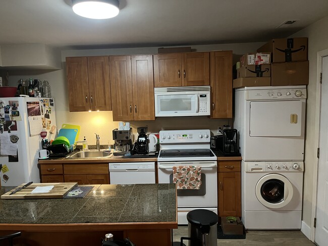 Kitchen. Large fridge. Dishwasher. Stove. Washer dryer. Bedroom. - 5723 213th St SW