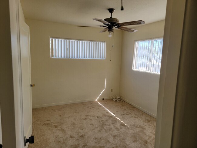 Bedroom with new carpet, paint, and blinds - 424 W Badillo St