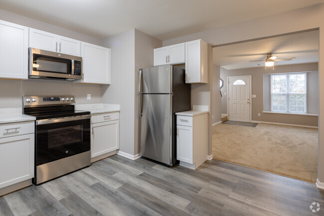 2BR, 1.5BA - 1,200SF - Kitchen and Living Room - Bristol Cove Apartments LLC