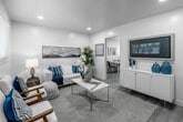 Located at 890 S Philadelphia St, Unit C in Anaheim, CA, this well-appointed 2-bedroom, 1-bathroom unit offers a thoughtfully designed single-level layout that maximizes its compact footprint. Light wood-tone flooring flows consistently throughout the home, creating a seamless and cohesive aesthetic.

The living room serves as the heart of the unit, featuring recessed lighting, bright white walls, and a large window fitted with blinds that invite natural light. The open feel of the space is accentuated by its clean lines and neutral palette.

Adjacent to the living area, the kitchen is outfitted with gray shaker-style cabinetry with matte black hardware, light stone countertops, a gas range with a range hood, and a built-in dining area. Dual windows and a rear door allow ample natural light and ventilation into the kitchen.

Both bedrooms are comfortably sized and include ceiling fans with light fixtures, closets, and windows with blinds. The primary bedroom offers a calm, restful atmosphere with warm natural light.

The shared bathroom features a full-size soaking tub with shower, white tile surround, a vanity with storage, and a small window for ventilation. A hallway connects all rooms efficiently, rounding out this clean, move-in-ready home.