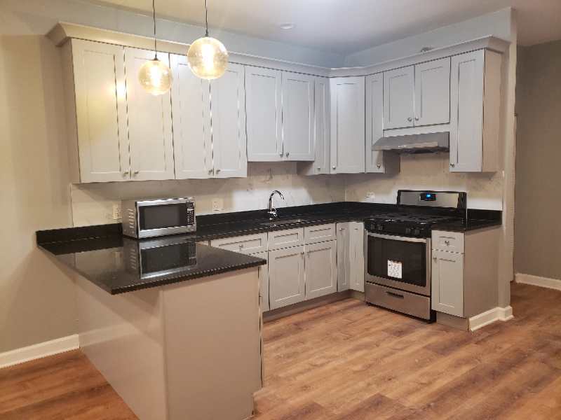 Newly remodeled kitchen with granite countertops and new appliances - 2892 S Archer Ave