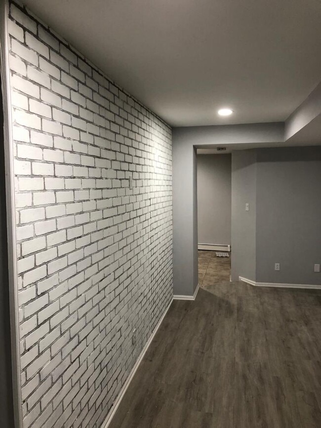 accent brick wall in living room - 214 Elm St