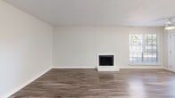Located at 900 Frances Way in Richardson, TX, this single-story 2-bedroom, 2-bathroom home offers a clean, modern aesthetic throughout. Wood-look flooring runs consistently across the entire layout, tying each room together with a warm, cohesive feel.

The open-concept living, dining, and kitchen area serves as the heart of the home. The kitchen is outfitted with white shaker-style cabinetry, bright white countertops, stainless steel appliances, and a peninsula with a black-fixture sink—providing both prep space and a natural gathering point. Recessed lighting keeps the space bright and functional.

Both bedrooms are well-proportioned, each featuring a ceiling fan, natural light from windows with blinds, and access to dedicated closets. The primary bedroom includes a spacious walk-in closet with dual shelving on each wall. The two bathrooms are finished with striking marble-style tub surrounds, black hardware fixtures, white vanities, and matching wood-look flooring for a polished look.

A hallway connects the private areas of the home and provides access to three closets, a laundry area, and a pantry, ensuring ample storage throughout. An entrance foyer and an outdoor patio round out the layout, adding both convenience and an opportunity for outdoor enjoyment.