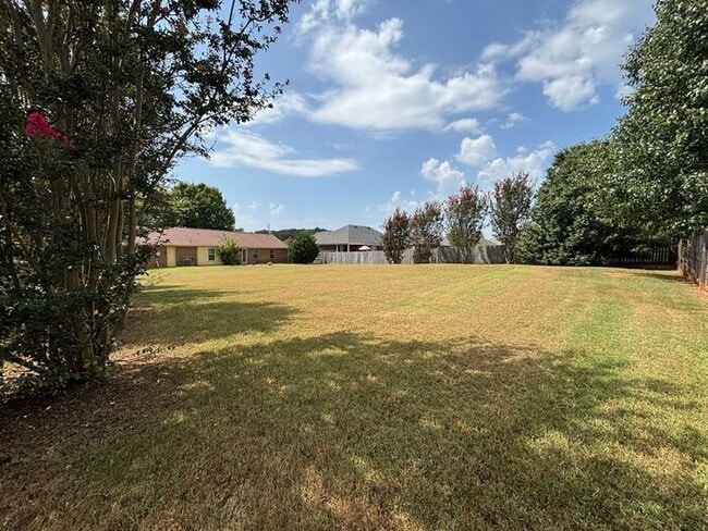 Building Photo - You will LOVE the fenced yard!