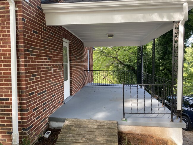 Car port conversion into porch off of living room. - 2028 Westover Dr