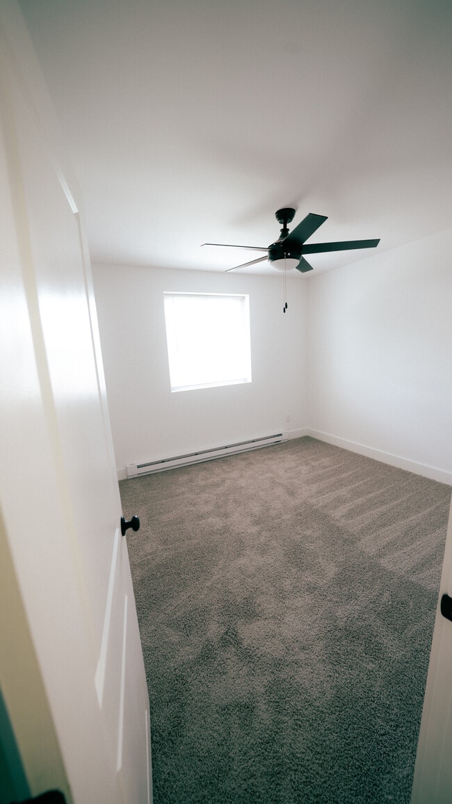 Unfurnished bedroom with ceiling fan, view 5 - Southgate Gardens Apartments