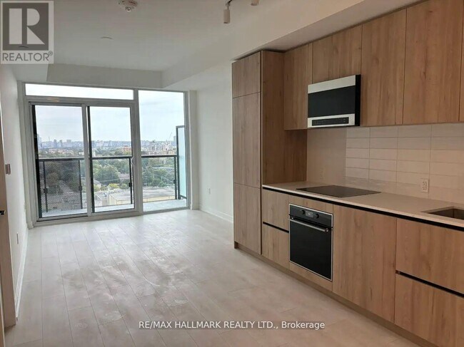 Photo du bâtiment - 127-1127 Broadway Ave