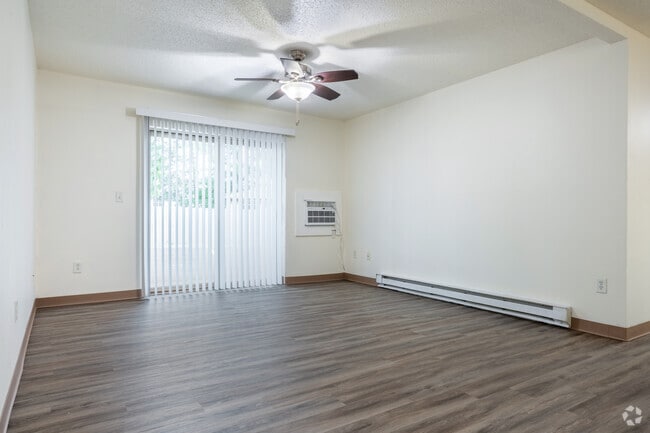 4BR, 2BA - 1,200SF - Living Room - Pioneer Court Apartments