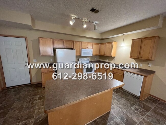 Building Photo - Huge End Unit Townhouse Available Now, Open Floor Plan, Loft Area, 2 Car Garage