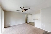 Located at 7200 Powers Ave in Jacksonville, FL, this single-floor, 2-bedroom, 1-bathroom residence offers a practical and comfortable layout. The open-concept living, dining, and kitchen area forms the heart of the home, filled with natural light from sliding glass doors that lead directly to a private patio, offering pleasant outdoor views. Ceiling fans throughout the living spaces add both function and character. The living area features soft carpeting and a neutral color palette that creates a bright, airy ambiance.

The kitchen is well-appointed with white cabinetry, granite-style countertops, wood-look flooring, and stainless steel appliances including a refrigerator, dishwasher, electric range, and microwave. A pass-through counter connects the kitchen to the dining and living space, enhancing the open feel.

Both bedrooms are carpeted and finished in soft neutral tones, with ample closet space — the unit includes four closets total. The primary bedroom is generously sized with direct patio access via sliding glass doors. The full bathroom features a clean, white tiled tub-shower combo with wood-look flooring. A hallway connects the private quarters, completing the efficient, well-organized floor plan.
