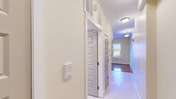 Located at 445 Zion St in Hartford, CT, this one-bedroom, one-bathroom unit offers a thoughtfully arranged single-floor layout that maximizes every square foot. The combined kitchen and living area serves as the heart of the home, where warm hardwood flooring transitions seamlessly to tile beneath the kitchen. Rich cherry wood cabinetry pairs with granite countertops, a white electric range, and a full-size refrigerator to create a functional and attractive cooking space. Natural light fills the open living area, enhancing the warm, neutral color palette throughout.

The bedroom is a comfortable, well-proportioned retreat featuring gleaming hardwood floors and two windows that invite an abundance of natural light and outdoor views of the surrounding greenery. A set of double doors opens to a dedicated closet, and the unit benefits from three closets in total, offering generous storage throughout.

The bathroom is finished with tile flooring, a rich wood vanity topped with granite, and a full-size mirror, creating a clean and practical space. A hallway connects the main living areas efficiently, and the overall layout feels organized and easy to navigate. Ceiling-mounted light fixtures, fresh neutral walls, and consistent finishes contribute to a cohesive, move-in-ready ambiance throughout this well-maintained Hartford residence.