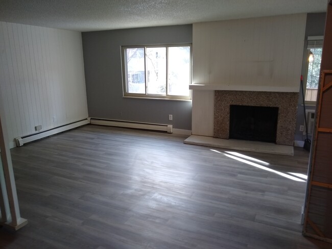 living room with wood fireplace - 3315 Chisholm Trail