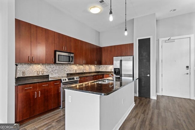 Building Photo - 711 Cosmopolitan Dr NE