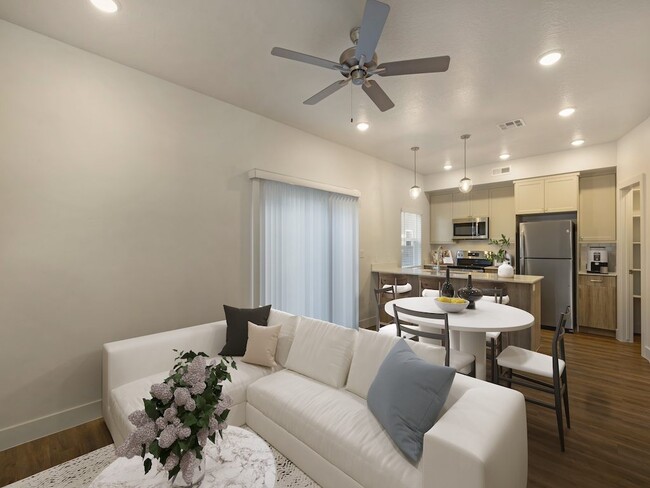 Comedor y sala de estar de primer nivel - Desert Sage Townhomes