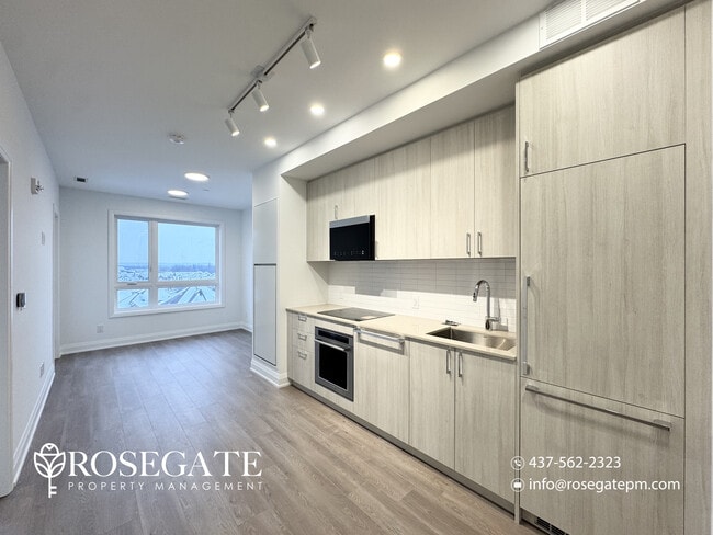 Building Photo - Modern 1 Bedroom + Den (Potential 2nd Bedroom) Condo with Parking & Balcony