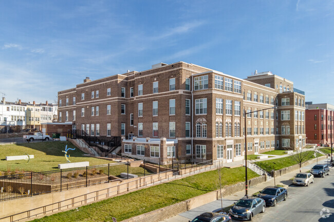 Exterior with courtyard - The Appleton at Spring Flats Senior 62+