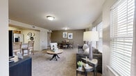 Located at 11308 SW Fifth St in Yukon, Oklahoma, this single-story 2-bedroom, 2-bathroom home offers a thoughtfully designed layout ideal for comfortable everyday living. The open-concept living and dining area is generously proportioned, featuring plush wall-to-wall carpeting, neutral-toned walls, and multiple windows that invite abundant natural light. The space flows seamlessly, making it well-suited for both relaxing and entertaining.

The kitchen is fully equipped with stainless steel appliances, including a range, microwave, and dishwasher, complemented by warm wood cabinetry, marble-style countertops, and tile flooring. A pantry provides convenient additional storage.

Both bedrooms are carpeted and feature ceiling fans, natural light from windows, and dedicated closets. The spacious primary bedroom offers a comfortable retreat, while the second bedroom is equally well-sized. Each bathroom is finished with tile flooring, wood-tone vanity cabinetry, marble-style countertops, and a tub-shower combination.

Additional practical spaces include a dedicated laundry area, a utility room, a hallway, and an entrance. Three closets throughout the home provide ample storage. The overall ambiance is warm, neutral, and move-in ready.