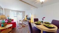 Located at 2096 Randy Scott Dr in West Carrollton, Ohio, this single-floor residence offers a well-organized and comfortable layout designed for everyday living. The open-concept living and dining area serves as the heart of the home, bathed in natural light streaming through large sliding glass doors that lead to an outdoor patio. A ceiling fan overhead adds both function and style to the space, while neutral carpet flooring creates a warm, inviting atmosphere throughout.

The galley-style kitchen is efficiently designed with dark cabinetry, granite-look countertops, a double-basin sink, and wood-look tile flooring. White appliances, including a refrigerator and electric range, complement the bold cabinetry for a clean, contrasting aesthetic.

The bedroom is generously proportioned, featuring plush carpeting, a large window that invites natural light, and a spacious closet offering ample storage. The full bathroom is neatly appointed with a white vanity, a mirror cabinet, and a tub-shower combination with wood-look tile flooring that ties in with the kitchen.

Overall, the space presents a functional, single-level floor plan with thoughtful finishes, abundant natural light, and convenient outdoor access, making it a comfortable and practical place to call home.