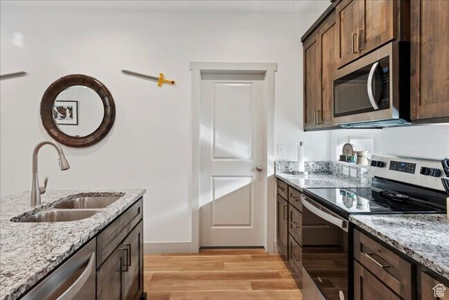 Building Photo - Modern End Unit townhouse w attached 2 car...