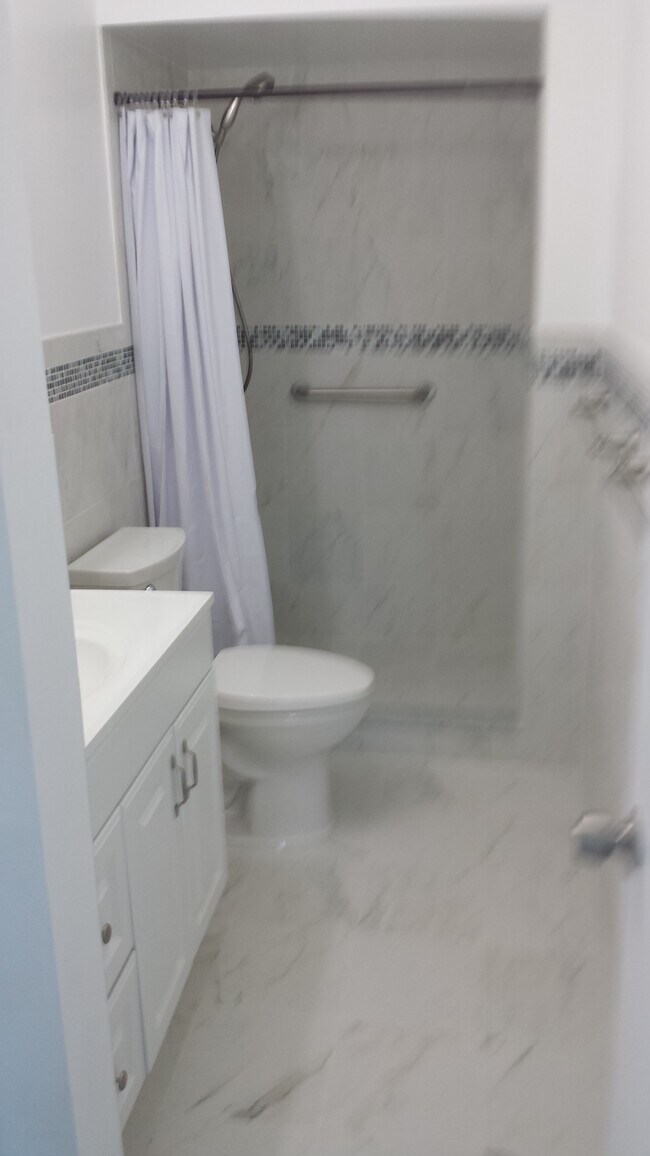 Bathroom w/ walk in shower - 450 NW 20th St