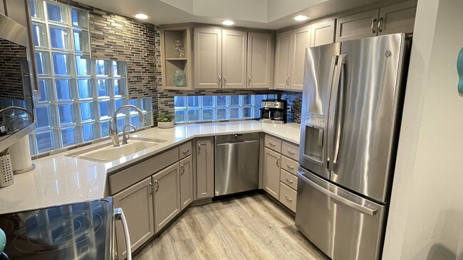 Open kitchen with GE profile appliances - 902 W Glendale Ave