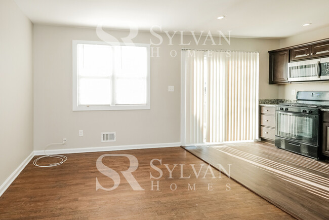 Building Photo - Welcome to this charming abode.