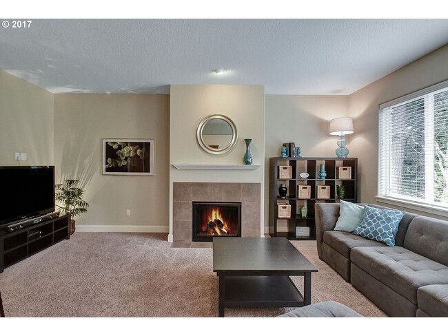 Building Photo - Bright and Open Floor Plan with Fireplace, Attached Garage & Vaulted Ceilings