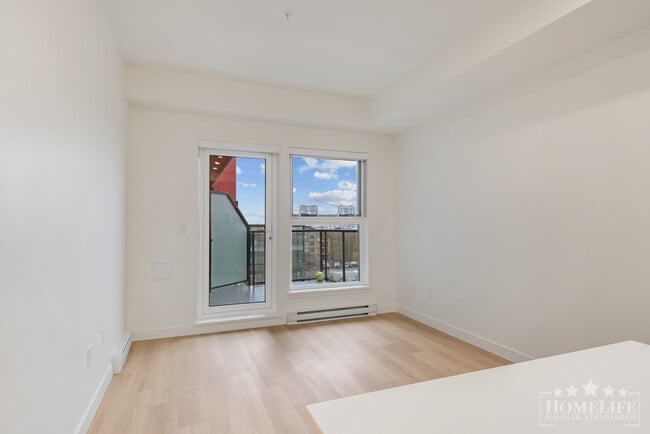 Building Photo - Modern 1 Bedroom + Den at The District at ...