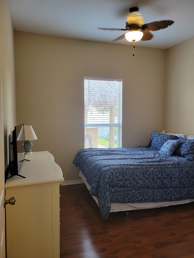 Bedroom 2 with queen bed and smart tv - 1305 SW 11th Plz