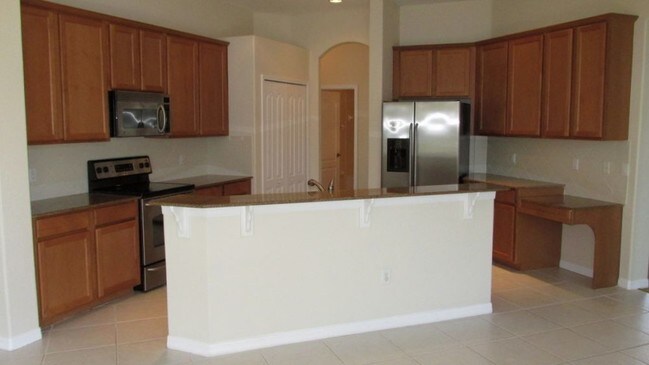 Building Photo - Spacious 4/3/3 with upgrades