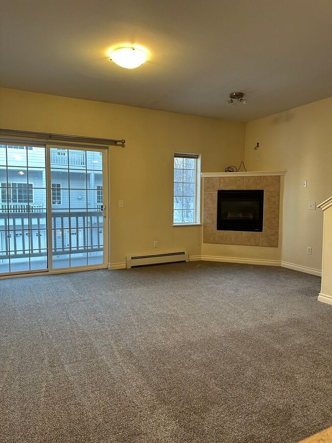 Building Photo - NEW CARPET THROUGHOUT| 2-Bedroom Townhome with Garage