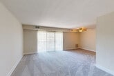 Located at 3412 Hewitt Ave in Silver Spring, MD, this single-floor, 2-bedroom, 2-bathroom home offers a thoughtfully designed layout with modern finishes throughout. The combined living and dining area is a standout space, featuring warm wood-look flooring, a ceiling fan, a subtly textured accent wall, and a large sliding glass door that floods the room with natural light and provides direct access to an outdoor patio area. The open, airy feel of this space makes it ideal for both relaxing and entertaining.

The kitchen is well-equipped with gray shaker-style cabinetry, granite countertops, stainless steel appliances including a dishwasher and refrigerator, and light wood-look flooring that ties seamlessly into the rest of the home. A dedicated hallway connects the living spaces to the private quarters, which include a generously sized primary bedroom with plush carpeting, a walk-in closet, and a bright window with outdoor views. The second bedroom also features soft carpeting and ample natural light. Both bathrooms are finished with granite vanities and clean tile flooring, with one bathroom featuring accessible grab bars. Six closets throughout the home ensure exceptional storage.