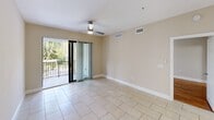 This contemporary 1080 square foot residence in Delray Beach, Florida offers a well-designed single-story layout with three bedrooms and two bathrooms. The home showcases a blend of modern amenities and practical living spaces.

The kitchen is a standout feature, boasting dark wood cabinetry, stainless steel appliances, and elegant granite countertops. The open concept design seamlessly connects the kitchen to the dining area, creating an ideal space for entertaining.

The primary bedroom, measuring 170 square feet, provides ample space for relaxation. All bedrooms feature warm hardwood flooring, adding a touch of elegance to the living spaces. The bathrooms are tastefully appointed with modern fixtures, including a glass-enclosed shower in one and a combination tub-shower in the other.

Throughout the home, neutral-toned walls and tile flooring create a bright, airy atmosphere. The living area is enhanced by a modern ceiling fan and recessed lighting. A notable feature is the balcony accessible through sliding glass doors, offering an outdoor extension to the living space and views of the surrounding area.

Storage solutions include two closets and built-in shelving, ensuring organized living. The property's single-floor design promotes easy accessibility and flow between rooms, making it suitable for various lifestyle needs.