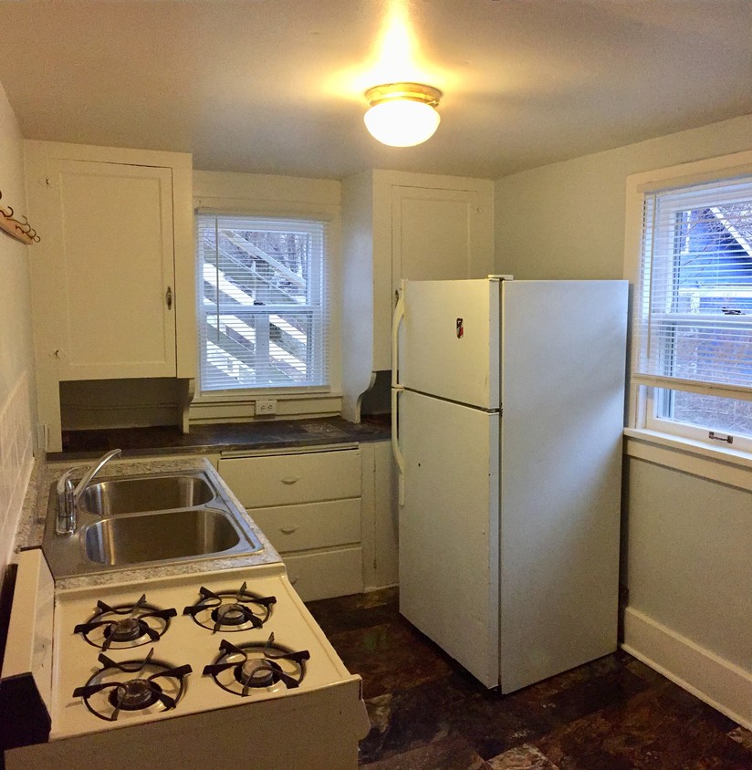 Kitchen w/ Stove and Refrigerator - 1411 Portland Ave