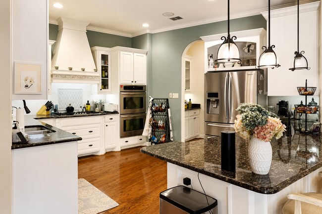 Building Photo - A Gated River Park Estate Where Timeless Tudor Elegance Meets Resort-Style Living