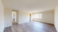 Located at 1260 Rossiter Ave in Baltimore, MD, this single-floor, 2-bedroom, 1-bathroom home offers a well-organized layout with consistent, modern luxury vinyl plank flooring throughout. The living room is open and bright, featuring neutral walls and direct access to the rest of the unit. The kitchen is equipped with warm honey-toned cabinetry, granite-style countertops, a gas range, dishwasher, and refrigerator. A window above the sink allows natural light to fill the space, while an adjacent area provides room for dining. The generously sized primary bedroom features two side-by-side closets, offering ample storage, along with durable LVP flooring and a window that lets in natural light. The second bedroom is a comfortable size with its own window and closet access. The full bathroom is clean and well-appointed, featuring a wood-toned vanity with a white countertop, a large mirror with overhead lighting, tile walls, and a full shower-tub combination. Neutral tones and consistent finishes are carried throughout the home, giving it a cohesive and move-in-ready feel.